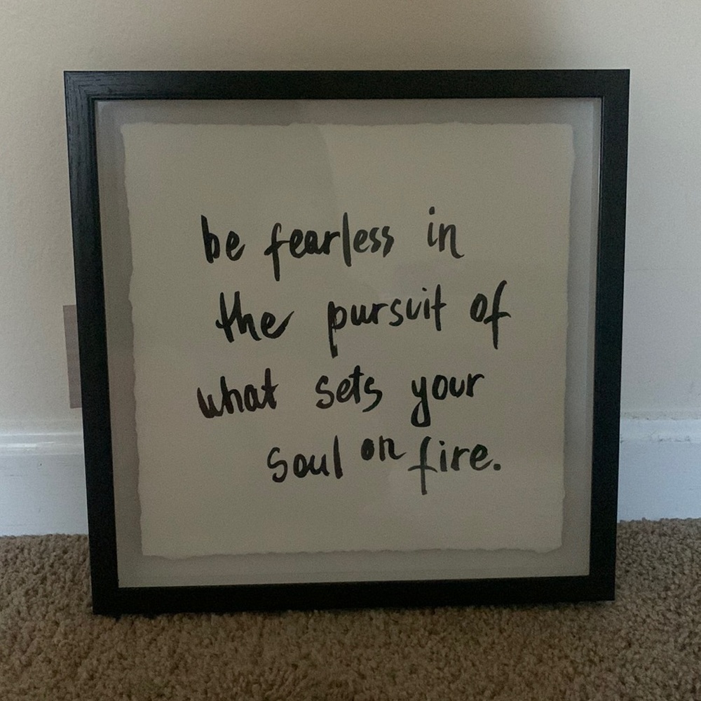 the frame an writing is black and it is a marmont art piece